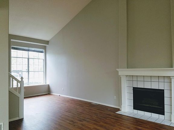 Living Room with Vaulted Ceiling and Fireplace