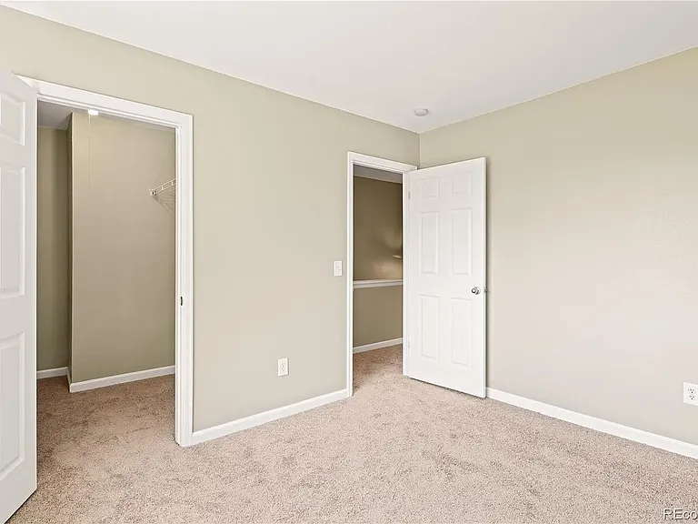 Upstairs bedroom with walk-in closet.