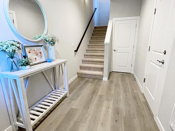 Spacious closet space next to stairways.