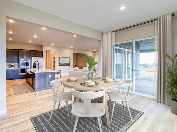 Off the kitchen is a quaint cafe with sliding glass door access to the backyard.