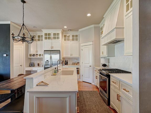 Quartz countertops and under mounted sink.