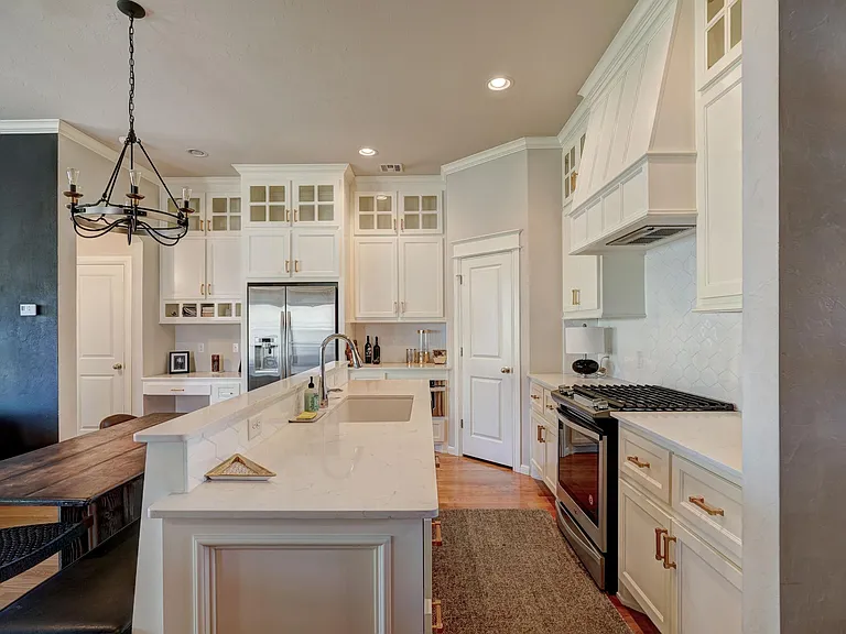 Quartz countertops and under mounted sink.
