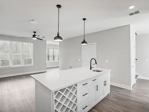 Open Kitchen layout with all new stainless steel appliances, designer lighting, quartz countertops, wine storage, etc.