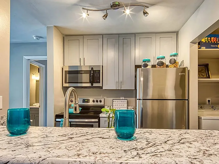 Kitchens have new cabinets and stainless steel appliances