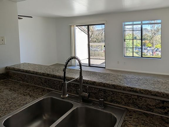Bright and functional kitchen layout with updated finishes and recessed lighting