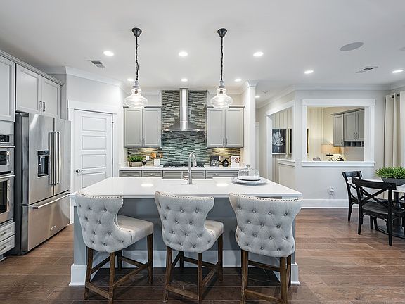 Gourmet Kitchen features with wall ovens and plenty of cabinet space. - Model Representation