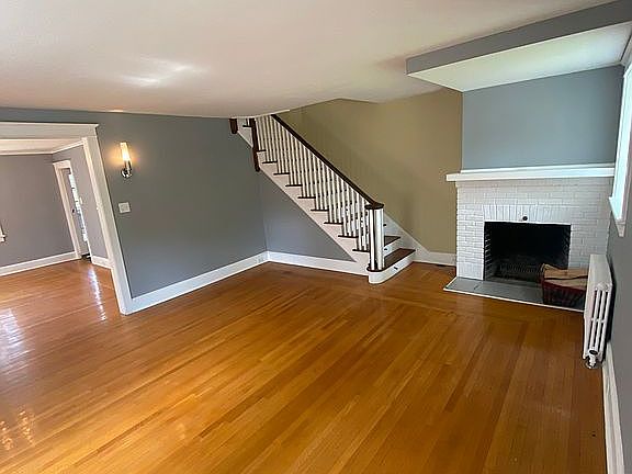 LIVING RM W/ WOOD FIREPLACE