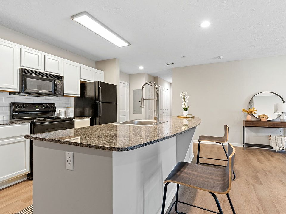 Enhance your dining experience with a spacious granite island and modern kitchen design in downtown Akron