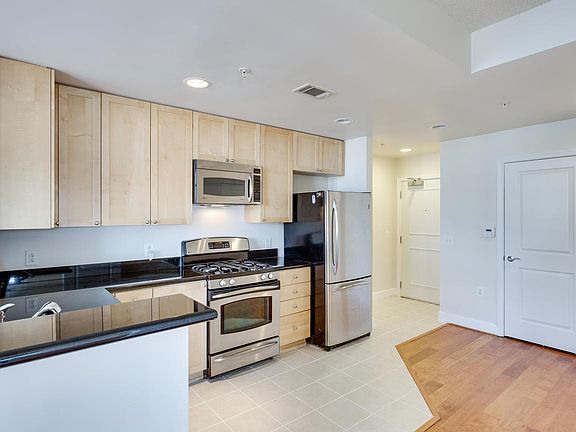 Gourmet kitchen with granite countertops and stainless steal appliances.