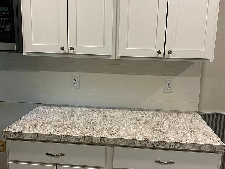 This is to the right of the stove in kitchen