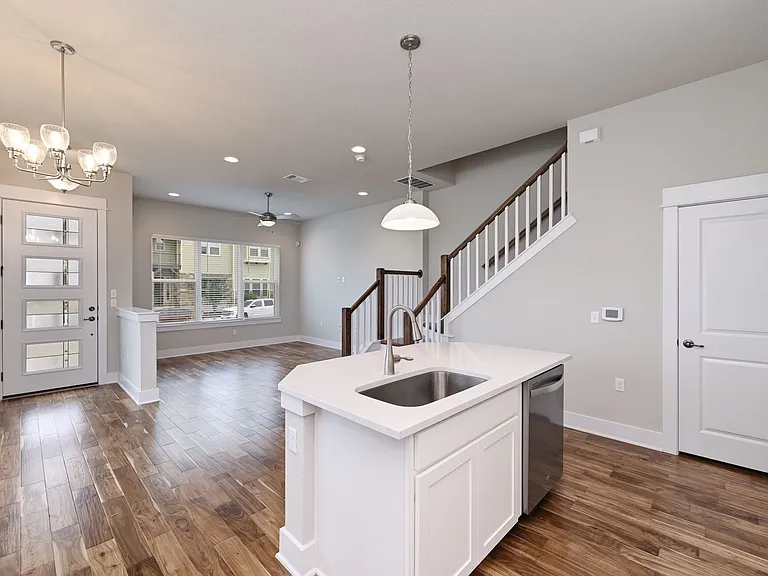 Living room, kitchen and stairway