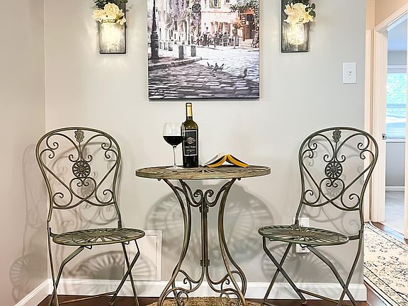 European inspired bistro table is a great place to enjoy a glass of wine or morning coffee