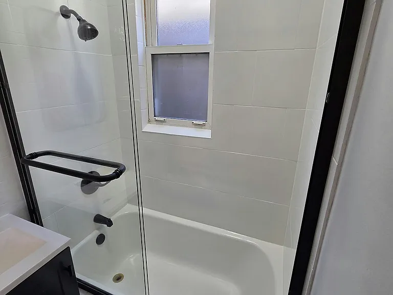 Newly glazed tub and shower walls w/new glass sliding door