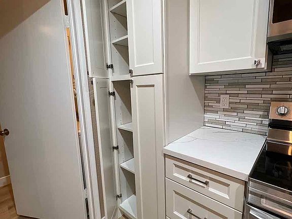 Large pantry in kitchen for storage.