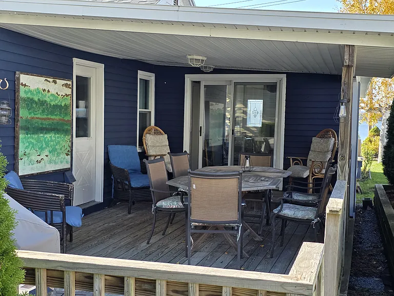Back patio with seating up to 10. Ramp for easy access to the home. Gas grill.