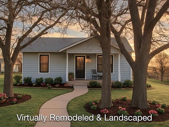 Bungalow-style house featuring covered porch and a front yard