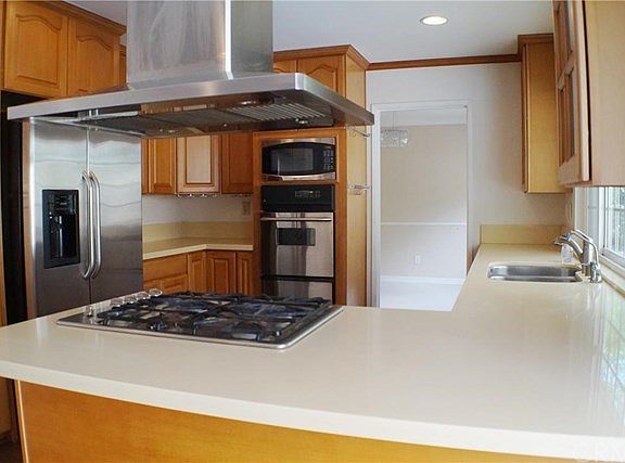 KITCHEN- upgraded cabinets with lazy susans, pull-out drawers, & soft-close doors. Quiet and high performance range hood with GAS cooktops....