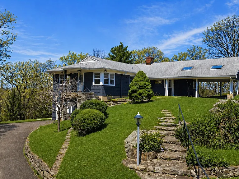 Tucked at the end of a quiet cul-de-sac, this exceptional estate offers rare privacy on more than 3 picturesque acres.