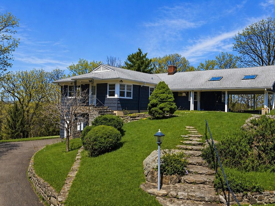 Tucked at the end of a quiet cul-de-sac, this exceptional estate offers rare privacy on more than 3 picturesque acres.