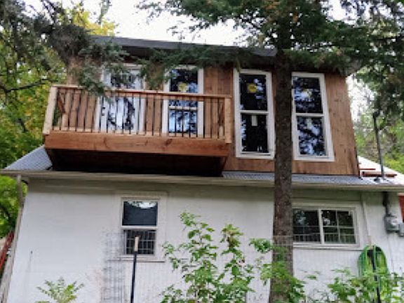 Newly added upstairs bedroom with small balcony.