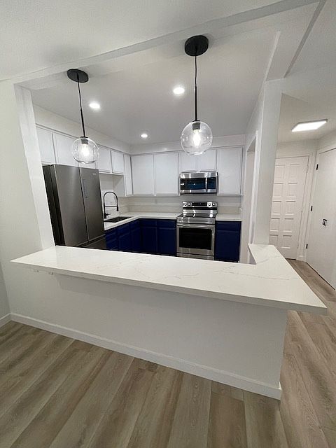 Large kitchen with large counter with overhang great for stools and eating