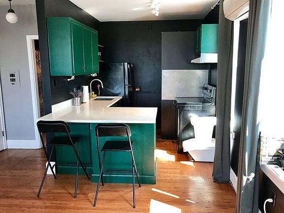 Open kitchen with eat at bar.