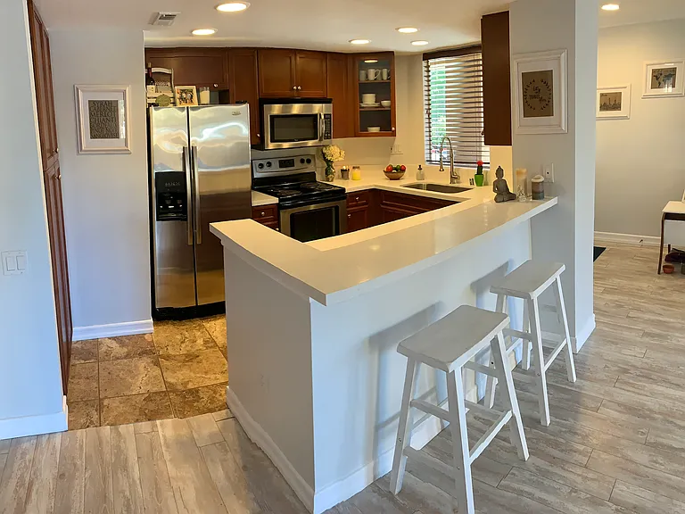 Kitchen open to the living room and patio.