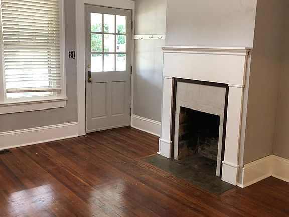 Freshly painted living area with hardwood floors