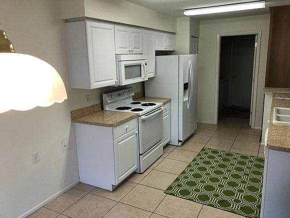 Kitchen Facing Laundry Room and Door to GarageKitchen Appliances