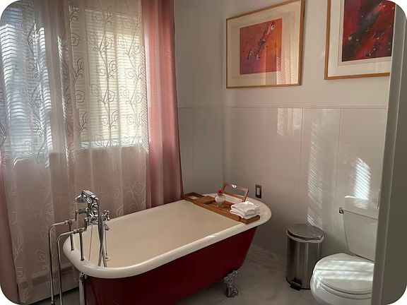 antique bathtub and toilet in 2nd floor
