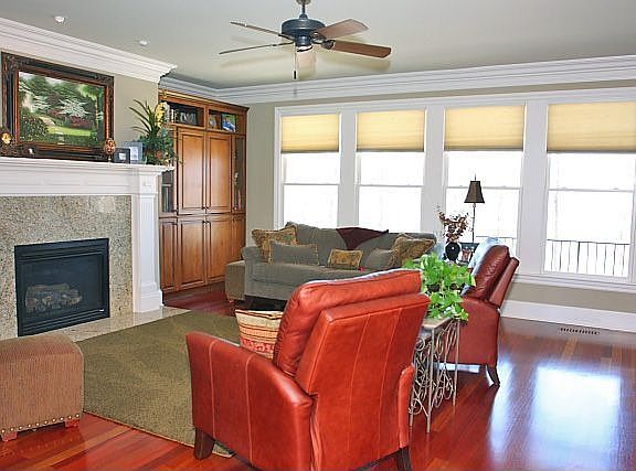 Family room has custom alder built-ins and brazilian cherry floors throughout 
