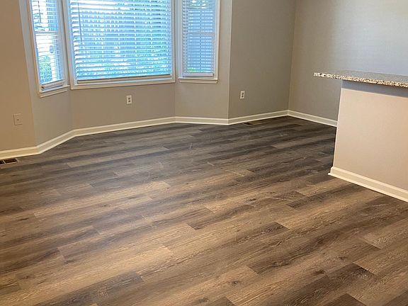 Living area with bay window and open floor plan
