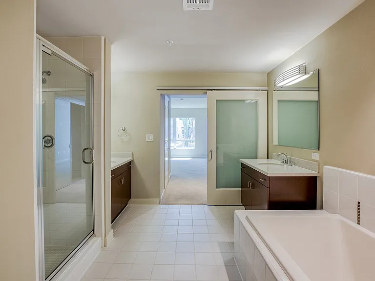 Walk-in showers with ceramic tile in select bathrooms
