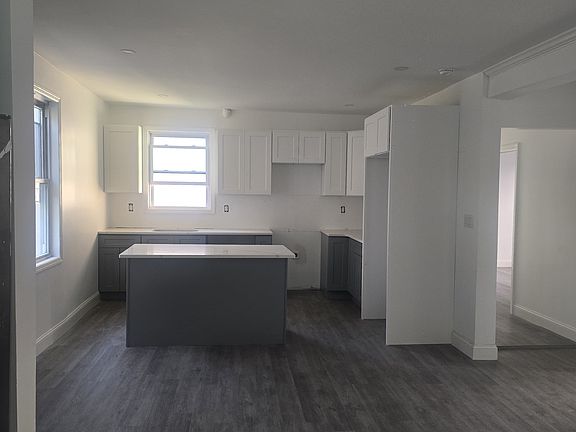 Renovated kitchen with kitchen island and stainless steel appliances including: fridge, stove, microwave and dishwasher. 
**Appliances will be in the apartment before move in date.