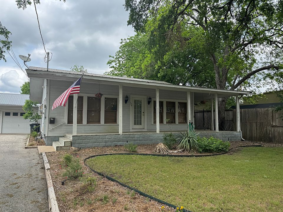 Front of the house facing Ferguson Street. Porch wraps around the front, right and back of the building.