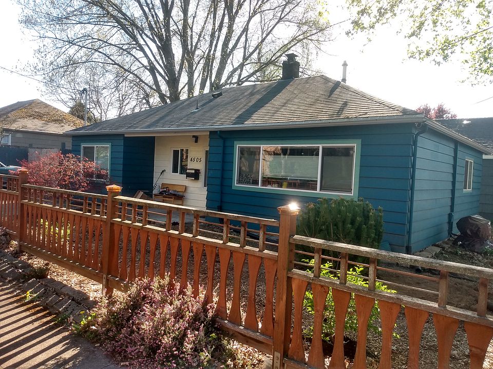 Exterior of house with lovely trees.