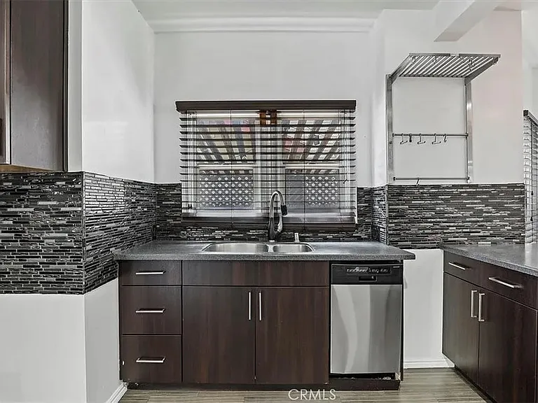 Kitchen with dishwasher and built in stove