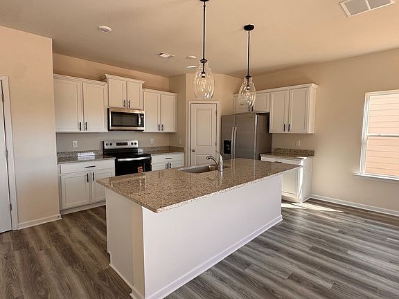 nice gourmet kitchen with Stainless steel appliances and large island