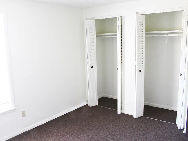 Carpeted Bedroom With Closet