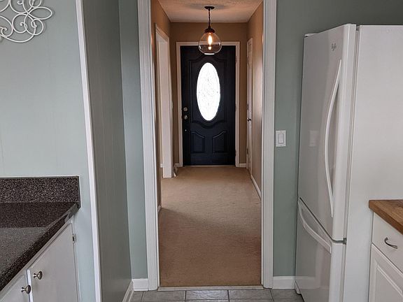 Kitchen into entry hall.