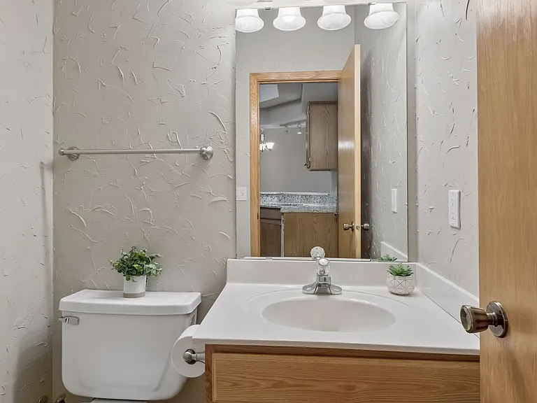 2nd Bathroom on Main Level from Kitchen. Texturized custom walls.