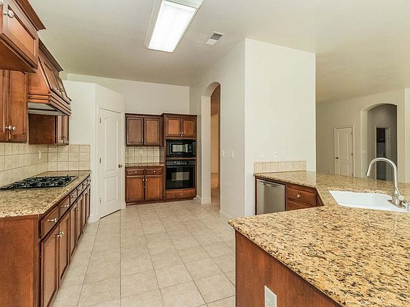 5th image of 8645 N Ann Ave