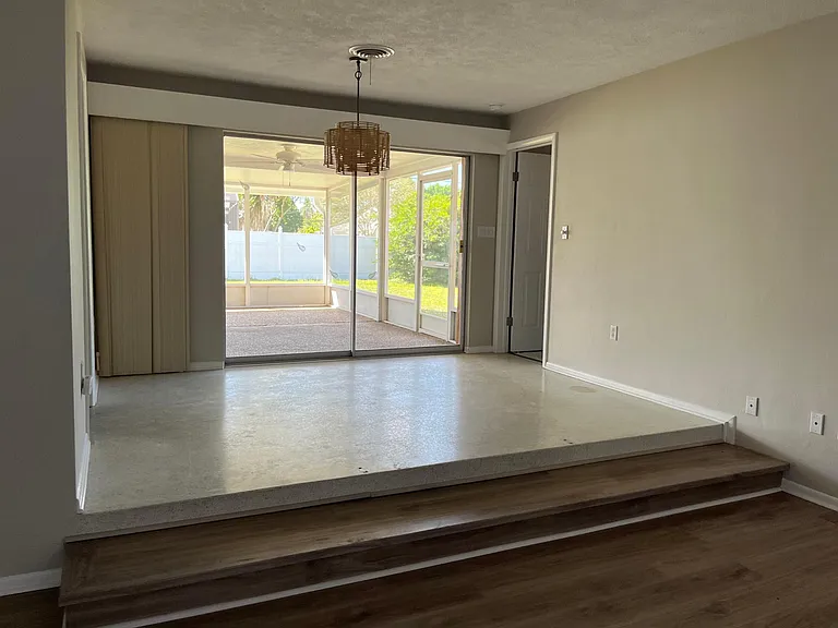 Current dining room with view to screened lanai