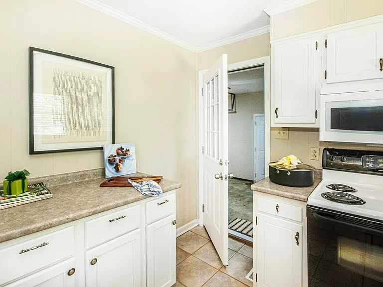 Abundance of countertop work space.
Door exits to garage which is an ideal location when bringing in the groceries