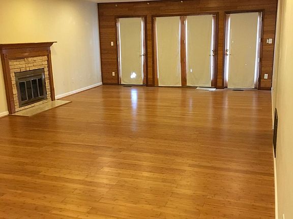 Looking North at 4 windows (one is also a door) that look out onto large back deck