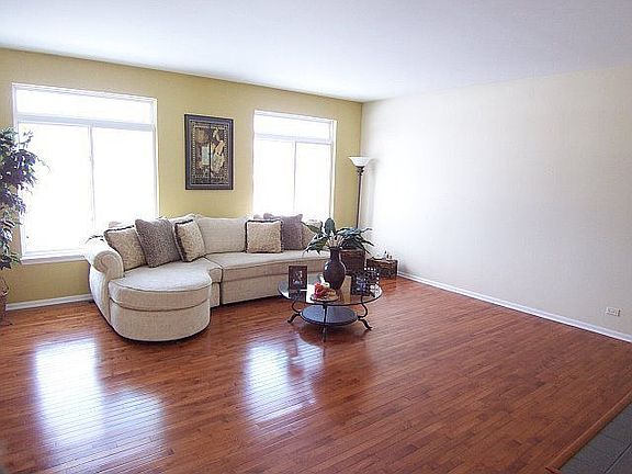 Family room features hardwood floors