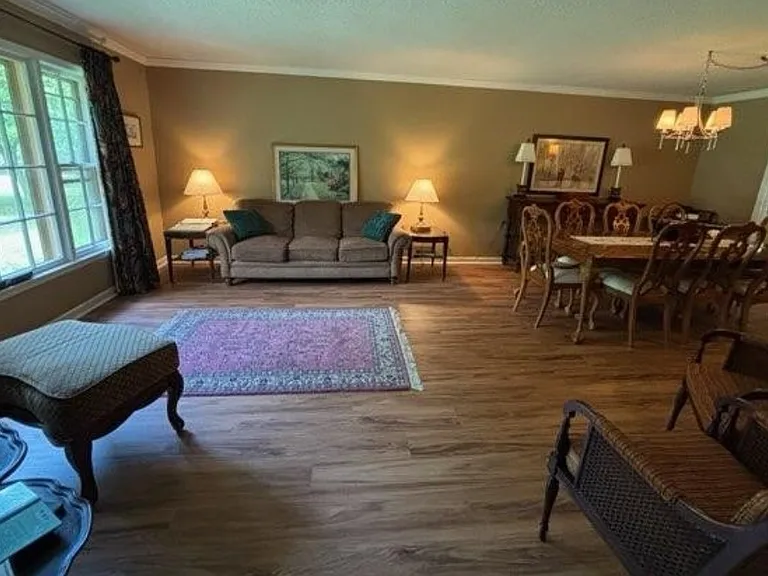 Living room with large picture window, new paint and new LVP flooring