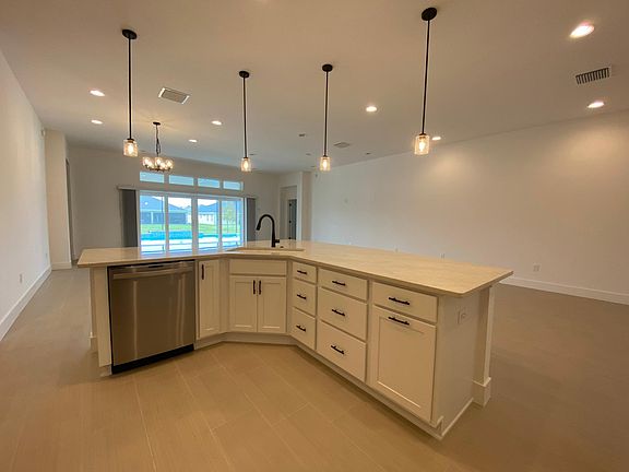 Gorgeous view of the pool from the island with plenty of cabinet space.
