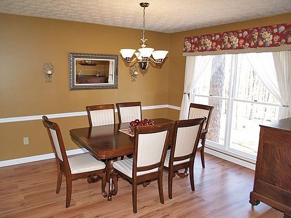 Large Formal Dining Room ready for family and friends.