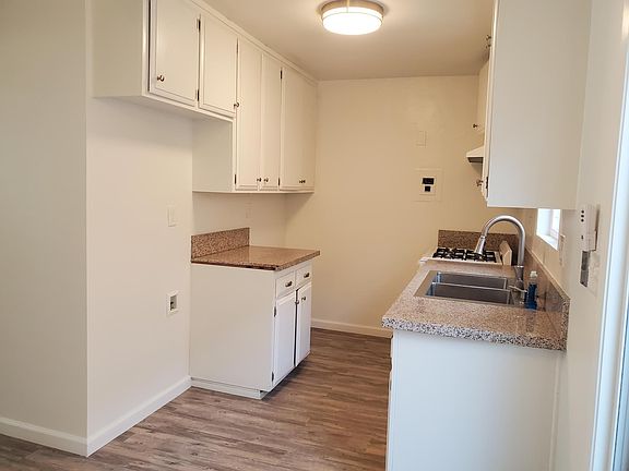 Water line for refrigerator and space for stack laundry center with gas dryer